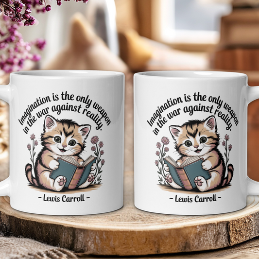 Two white mugs with a kitten illustration and Lewis Carroll quote on a wooden surface.