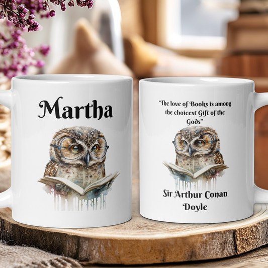 Two mugs with owl illustrations and text on a wooden surface.