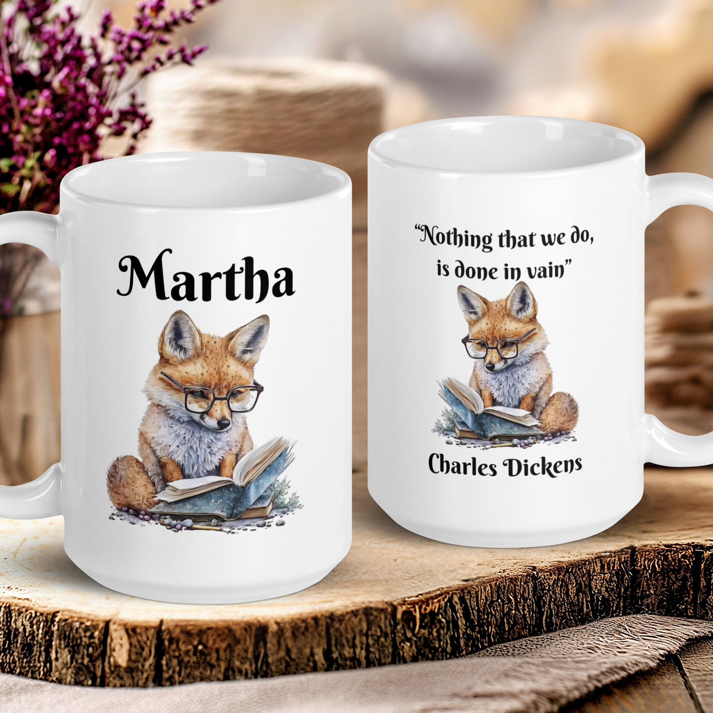 Two mugs with fox illustrations and text on a wooden surface.