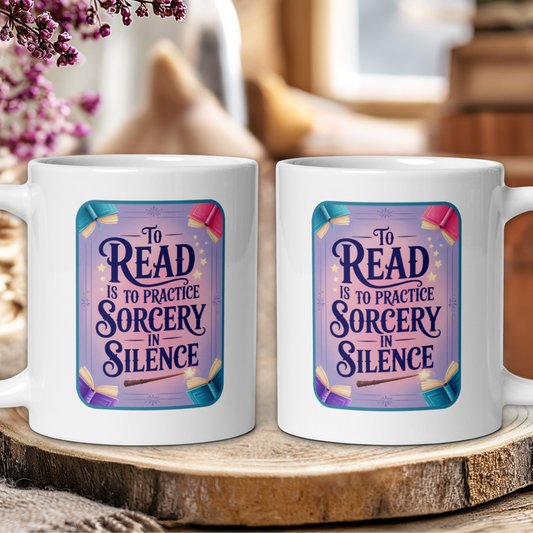 Two white mugs with a purple design and text on a wooden surface.