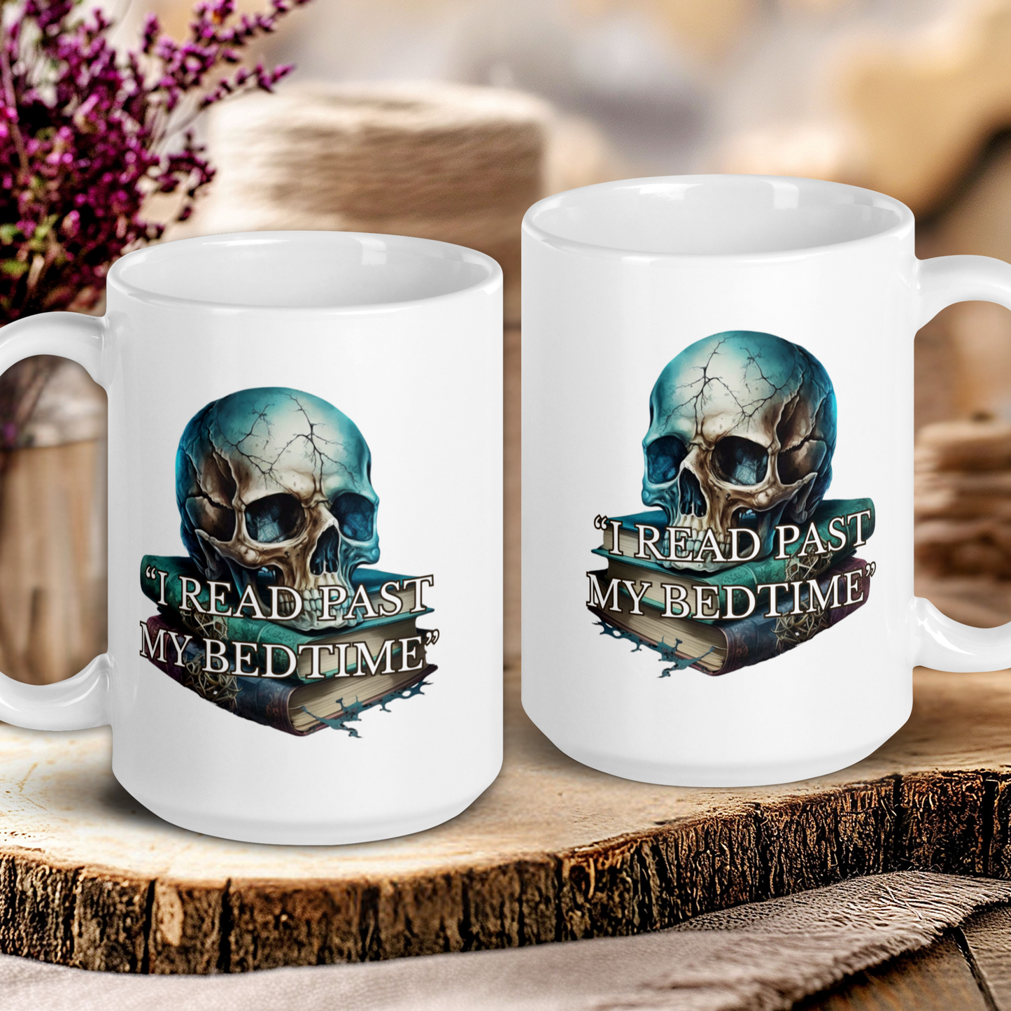 Two white mugs with skull designs and text on a wooden surface.