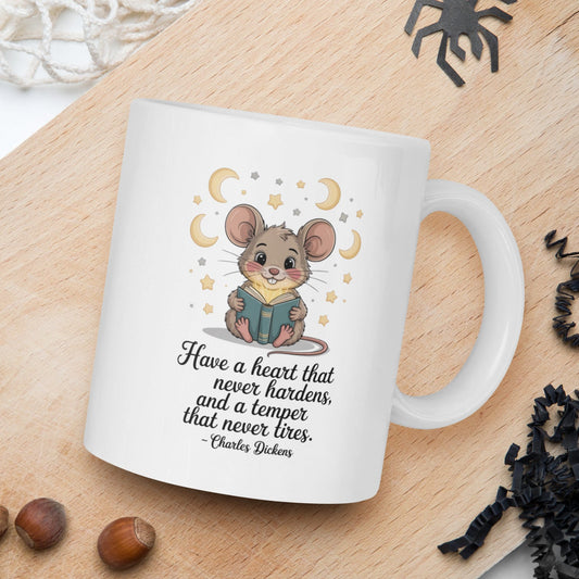 White mug with a mouse illustration and text on a wooden board with nuts and spider decorations.