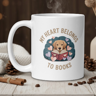 White mug with a dog illustration and text 'My heart belongs to books' on a wooden table with a warm background.