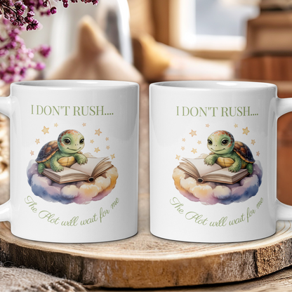 Two white mugs with a turtle design and text on a wooden surface.