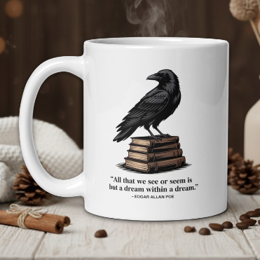 White mug with a crow design and Edgar Allan Poe quote on a wooden table with coffee beans and a vase in the background.