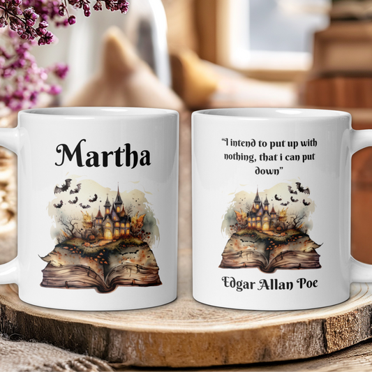 Two mugs with a castle design and text on a wooden surface.