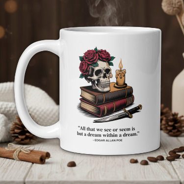 White mug with skull and roses design, placed on a wooden surface with coffee beans and a vase in the background.
