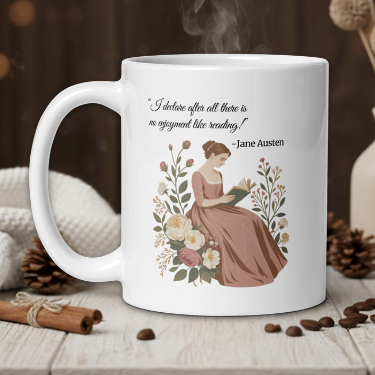 White mug with a design of a woman reading a book, surrounded by flowers, on a wooden table with a warm background.