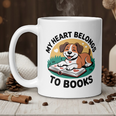 White mug with a dog illustration and 'My heart belongs to books' text on a wooden table with coffee beans and a vase.