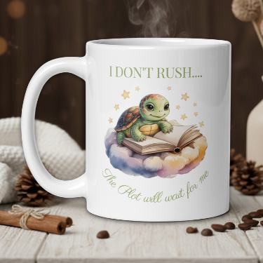 White mug with a turtle illustration and text on a wooden table with coffee beans and a vase.