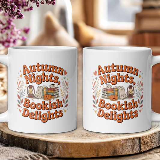 Two white mugs with 'Autumn Nights, Bookish Delights' text on a wooden surface.