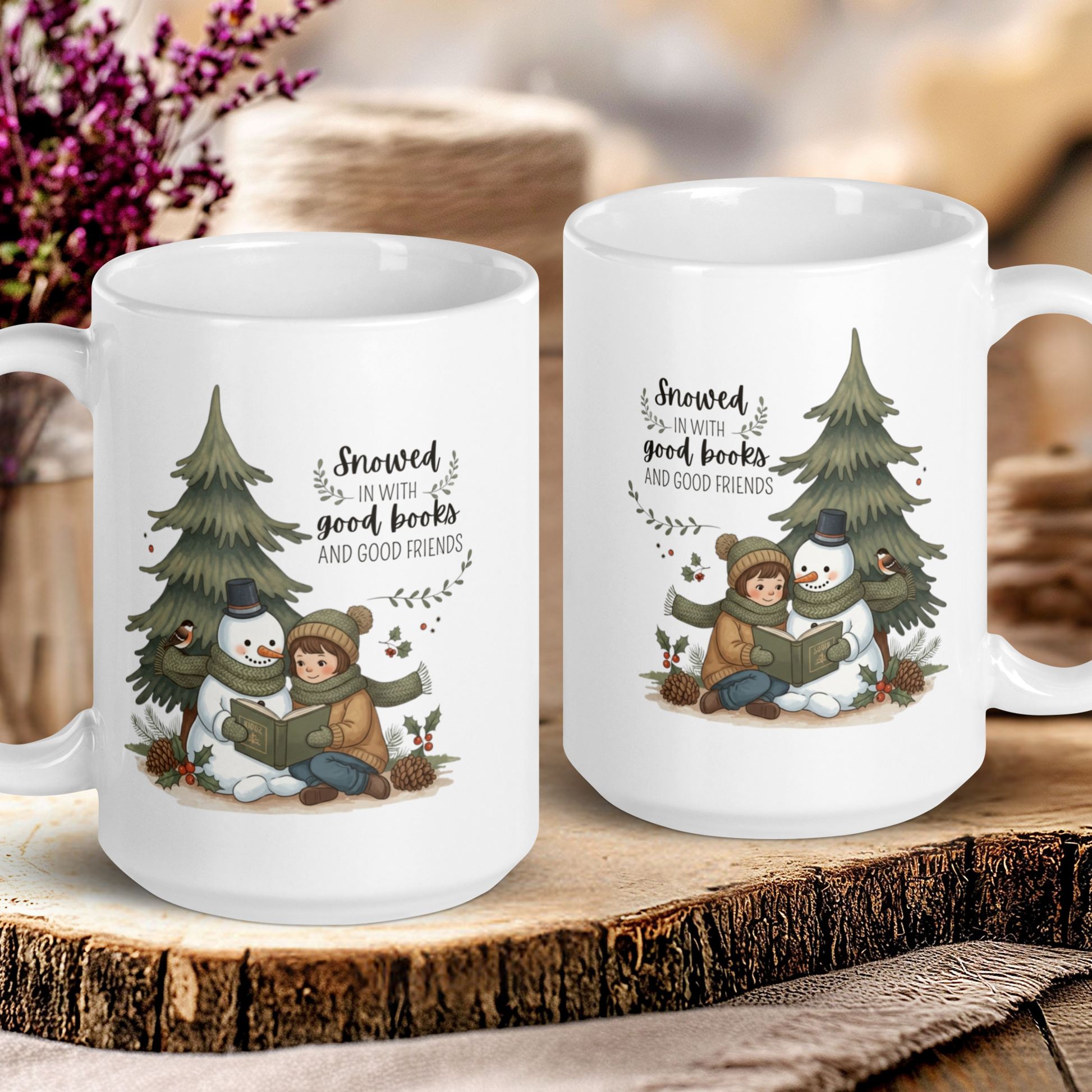Two white mugs with winter-themed designs on a wooden surface.