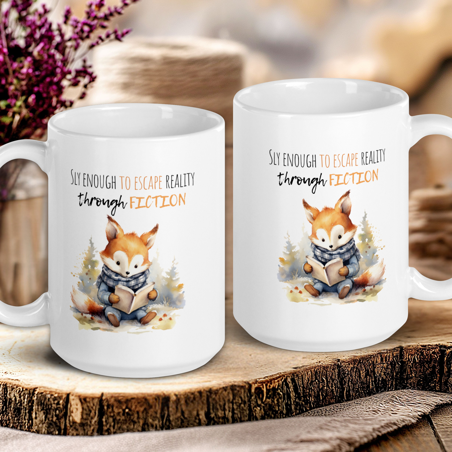 Two white mugs with fox illustrations and text on a wooden surface.