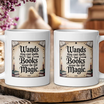 Two white mugs with a book-themed design on a wooden surface.