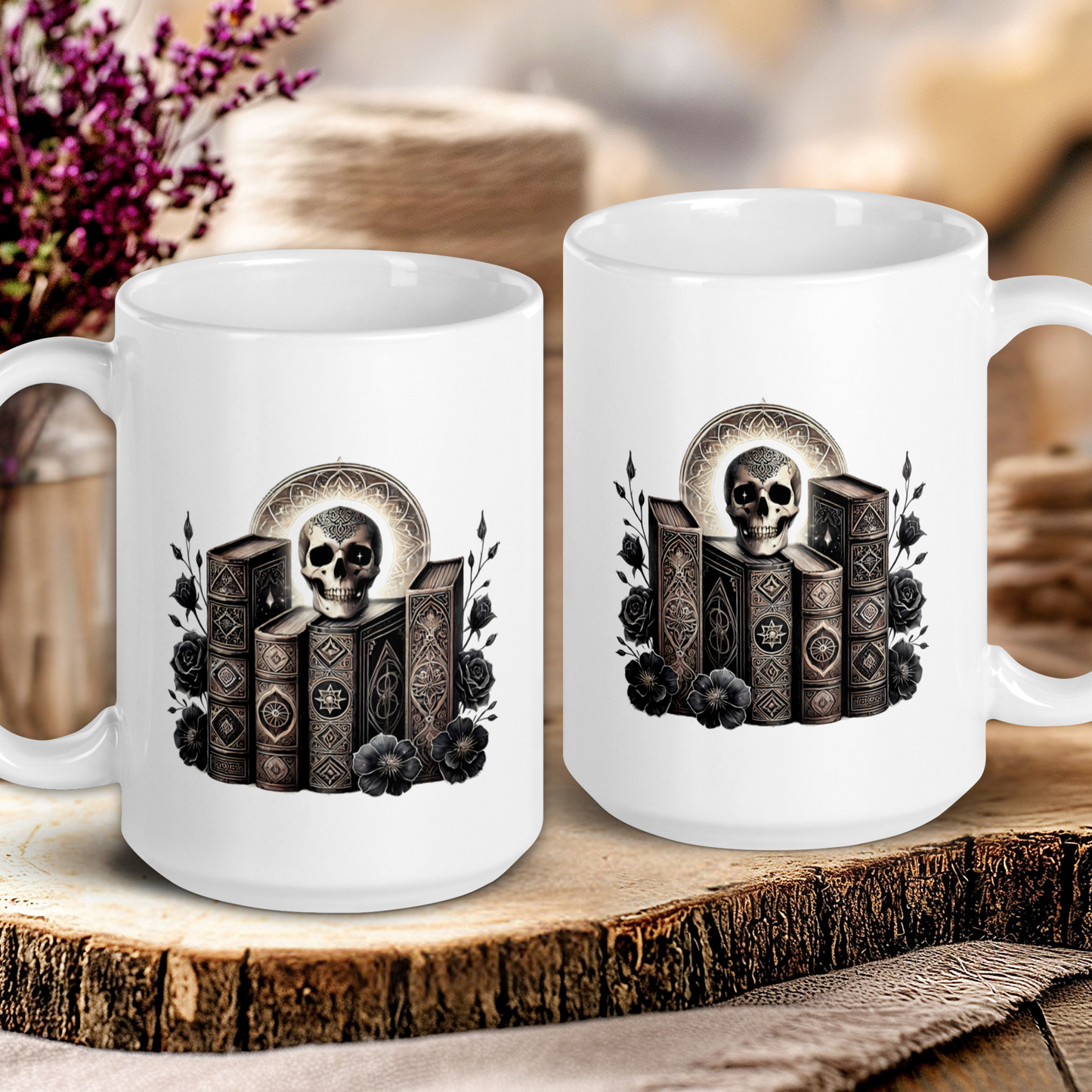 Two white mugs with skull and book design on a wooden surface.